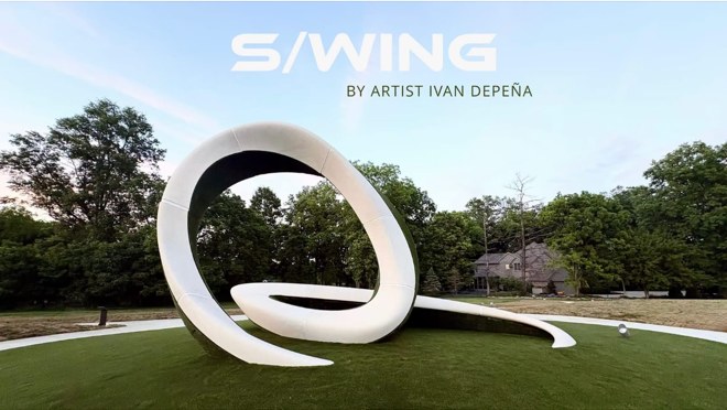S/WING, a white looping sculpture by Ivan Depe&ntilde;a, standing on a lawn between Whittingham Drive and Muirfield Drive in Dublin, Ohio